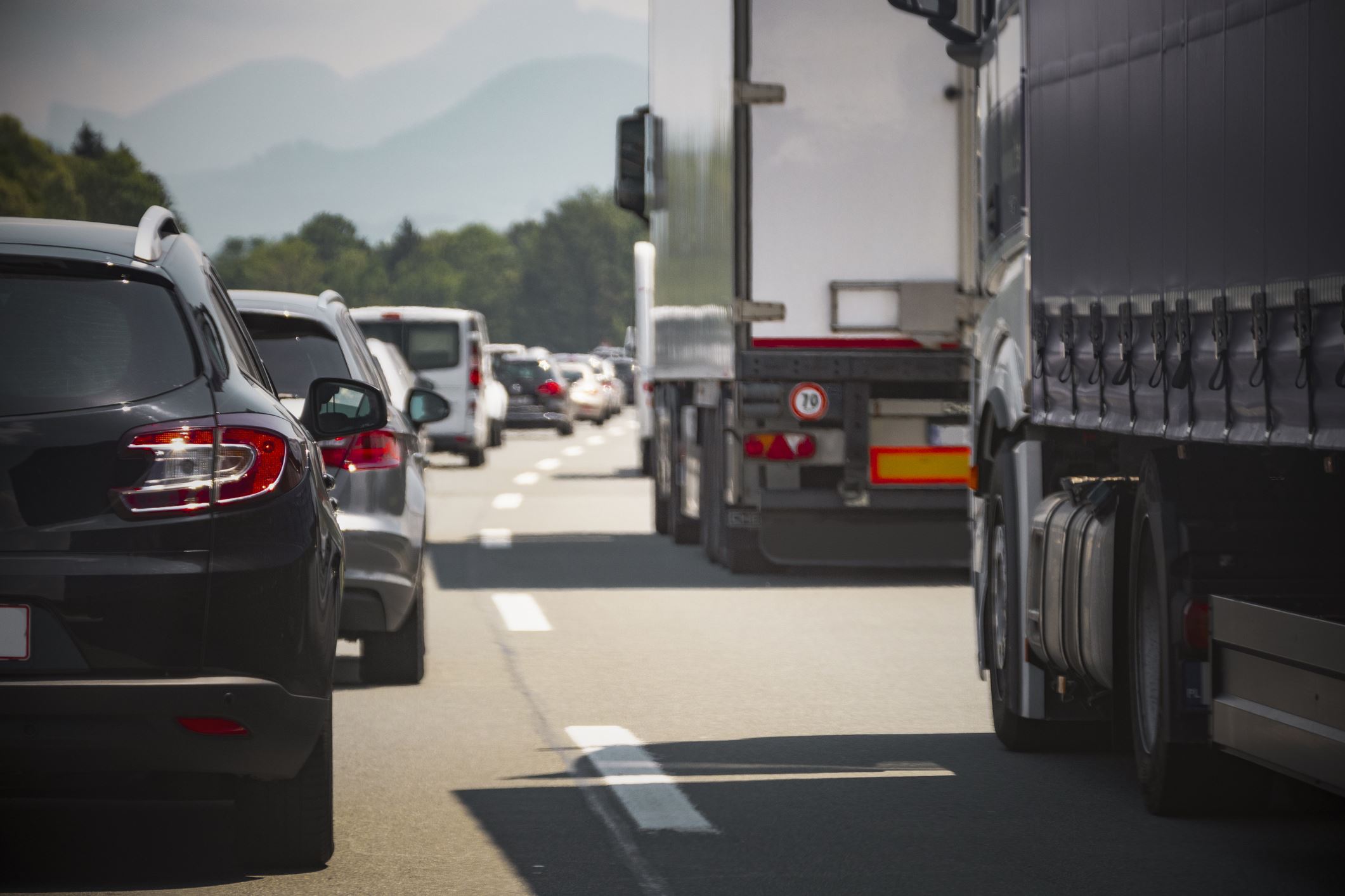 semi truck on road with cars