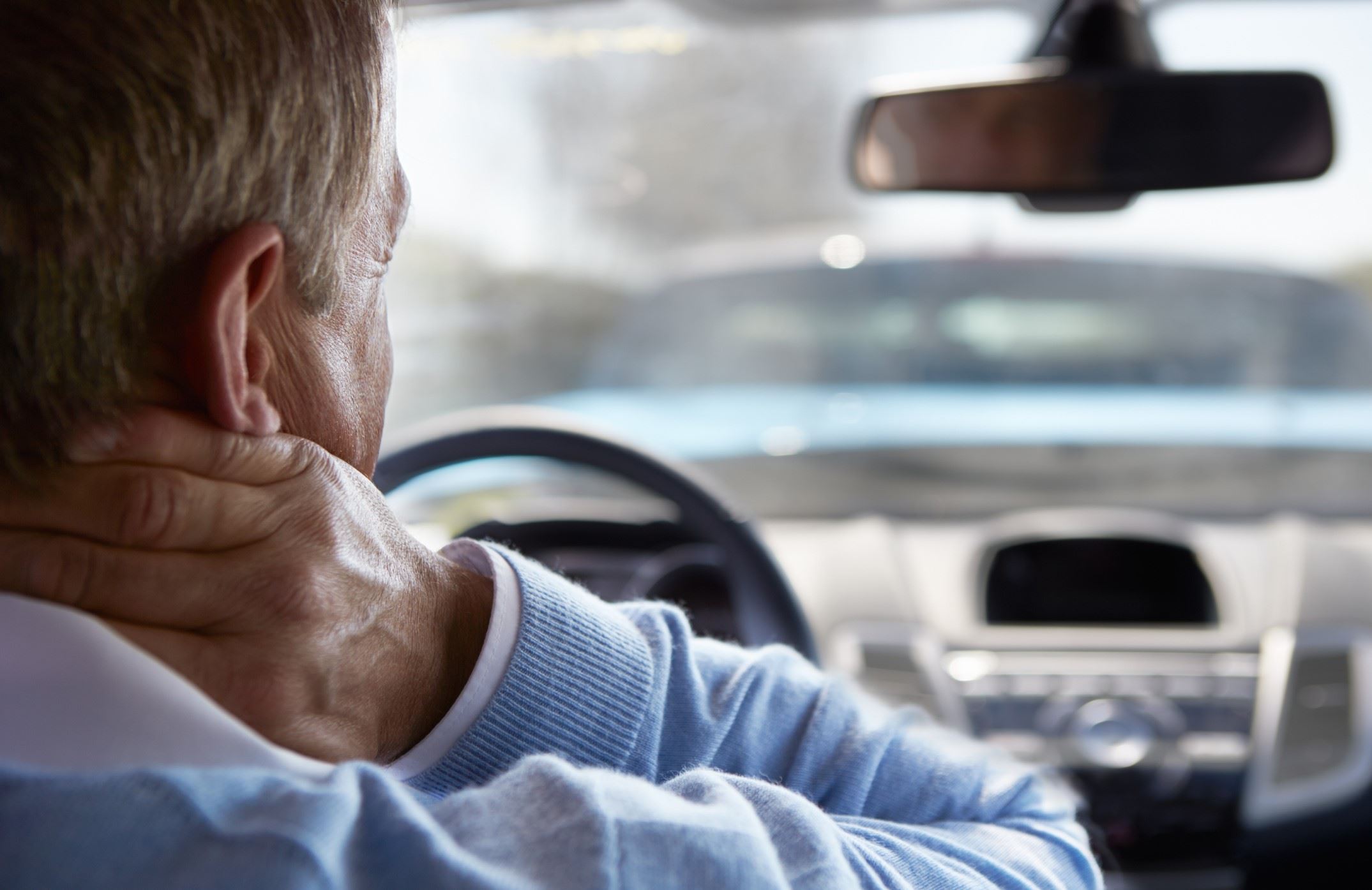 man holding neck whiplash