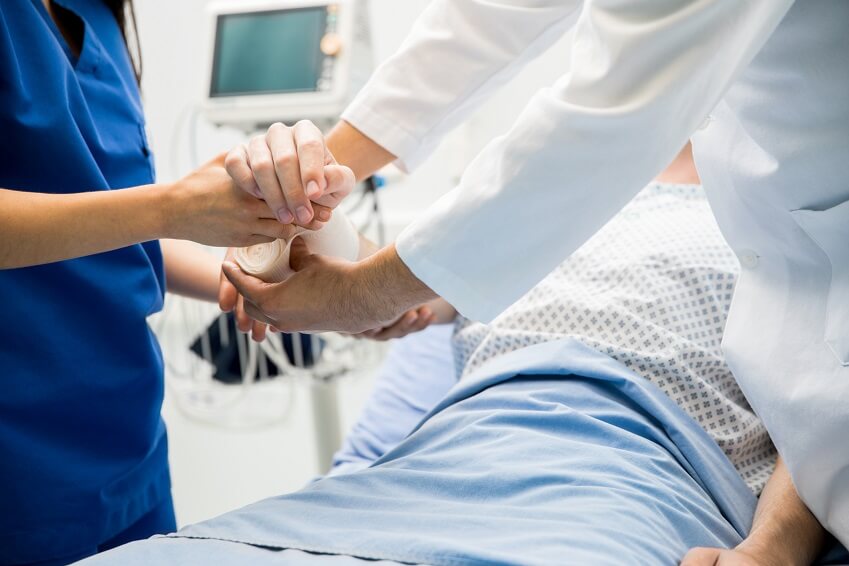 hospital patient getting arm wrapped