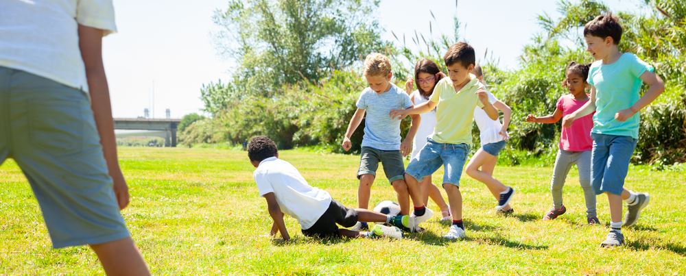 children playing soccer during summer